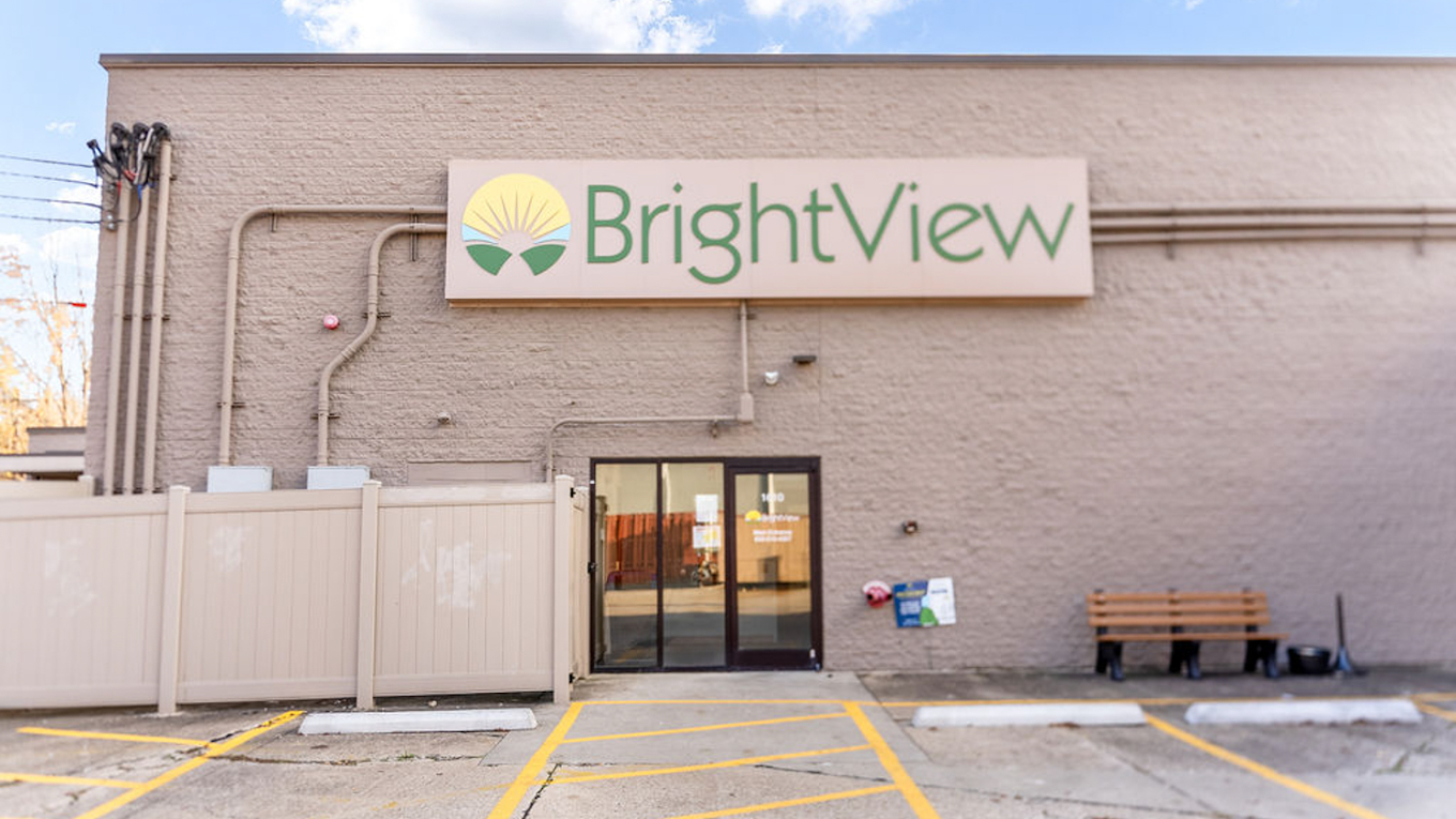 Exterior entrance of BrightView Health Covington with large BrightView sign above the doorway and marked parking spaces
