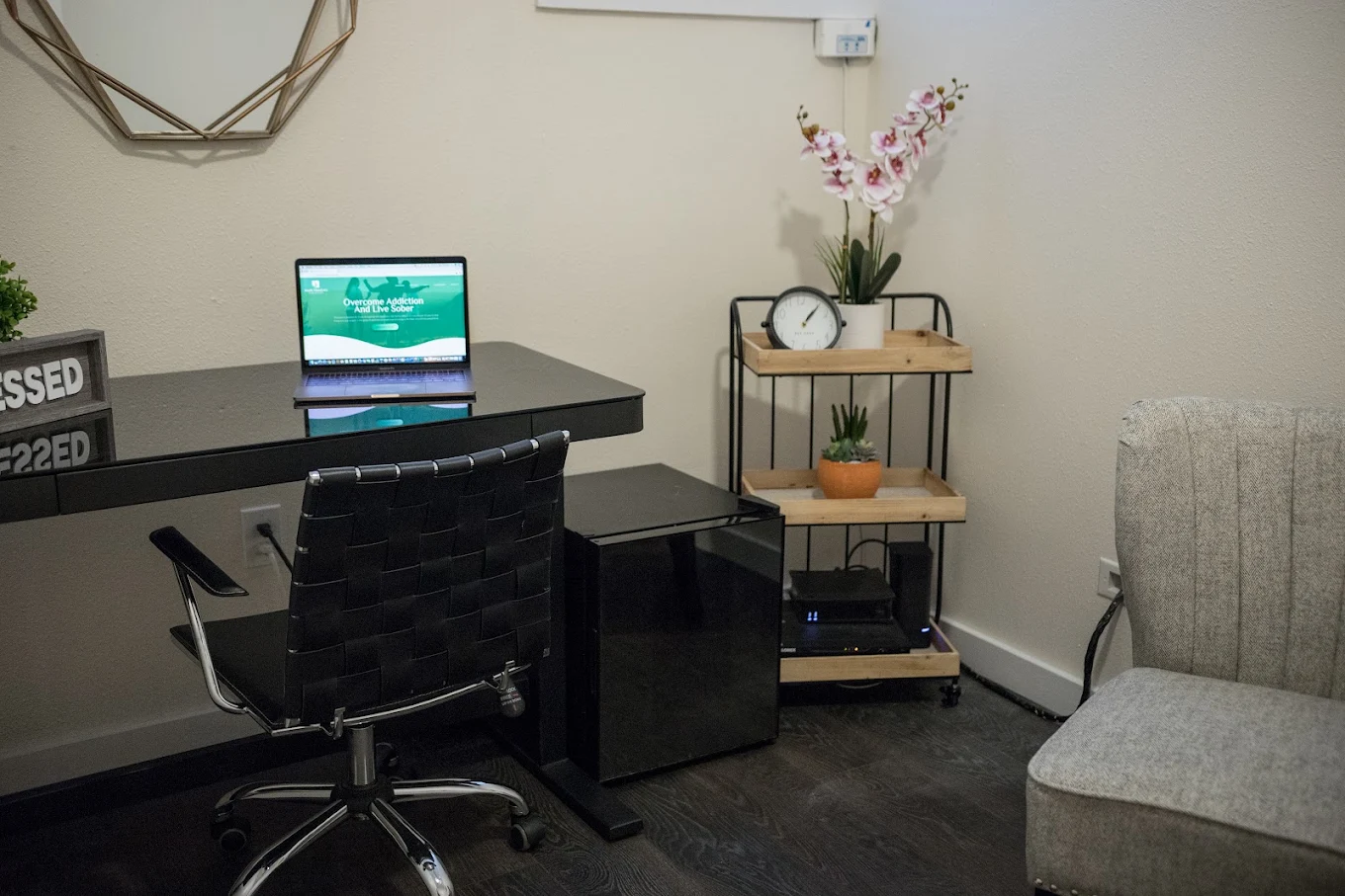 Consultation room with desk, computer, and guest chair