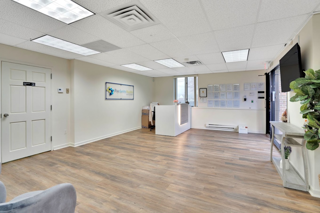 Lobby with a reception desk and seating.