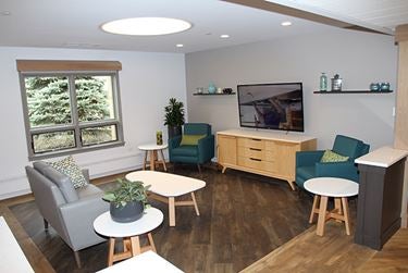 Comfortable seating area with TV and natural light