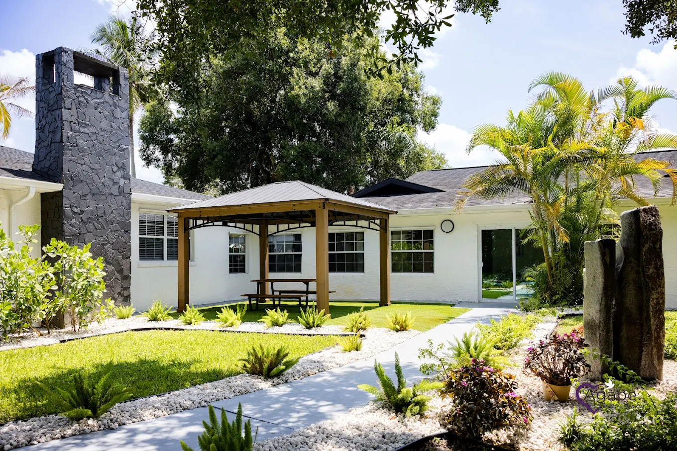 Landscaped courtyard featuring gazebo and walking path