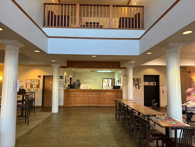 Spacious lobby with reception desk and seating