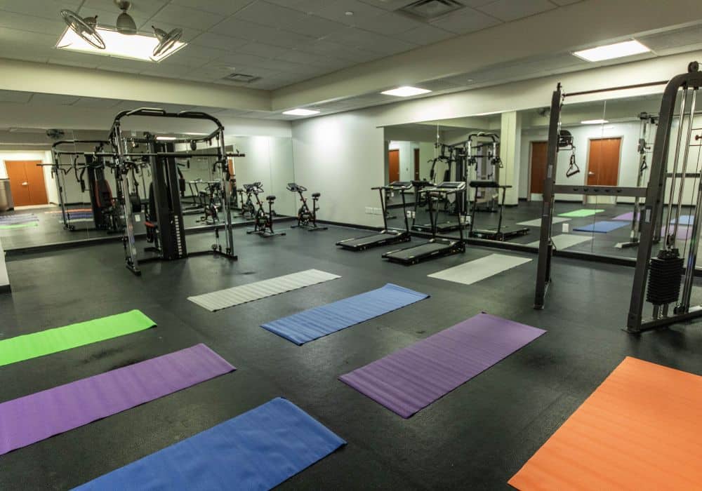 Fitness center with cardio equipment and exercise mats