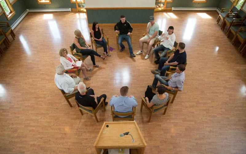 Group therapy session in large open room