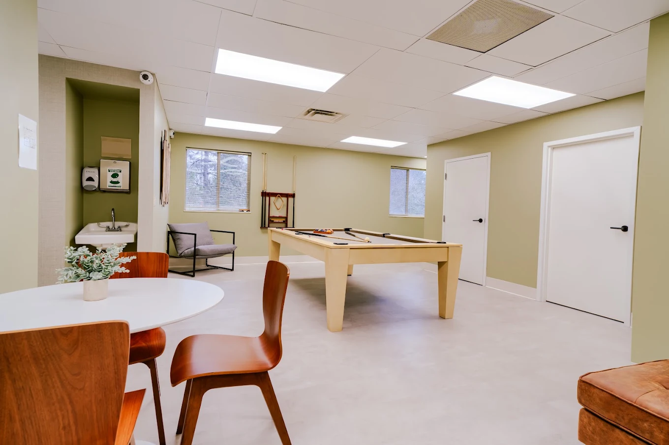 Recreation room with pool table and seating area