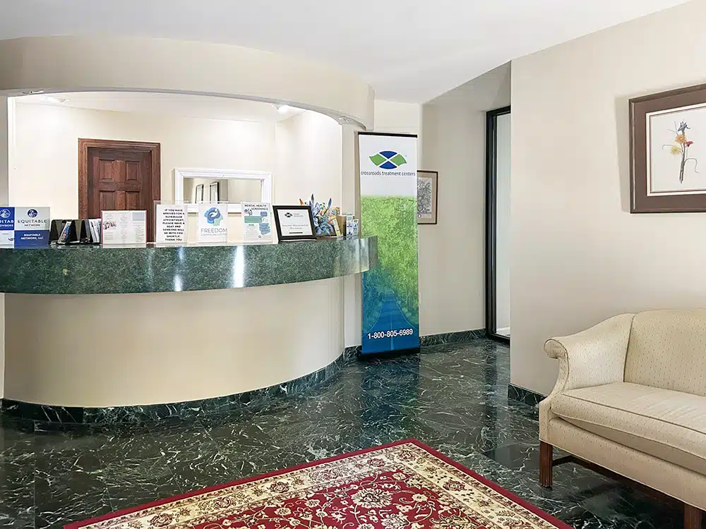 Reception desk and waiting area inside treatment center lobby