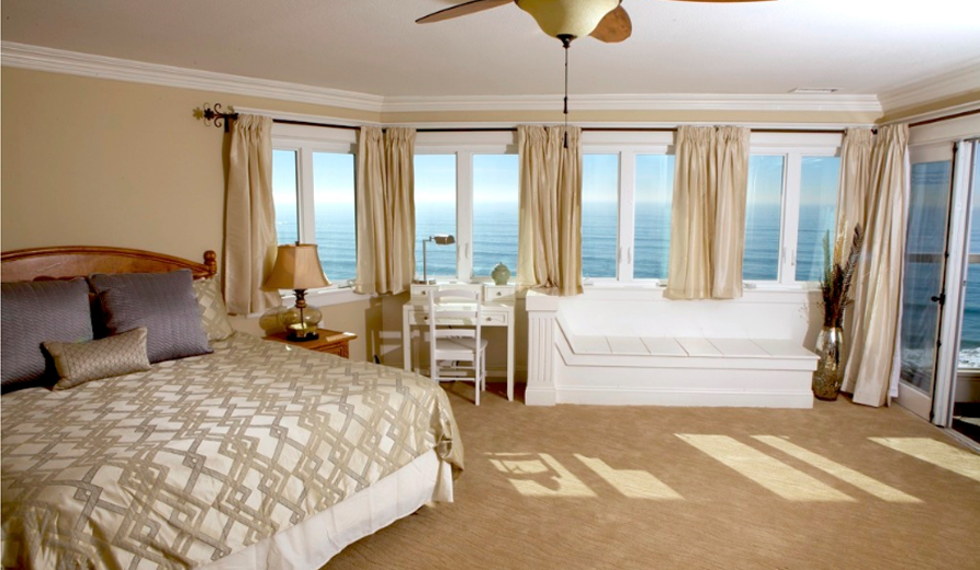  Spacious bedroom with ocean-facing windows.