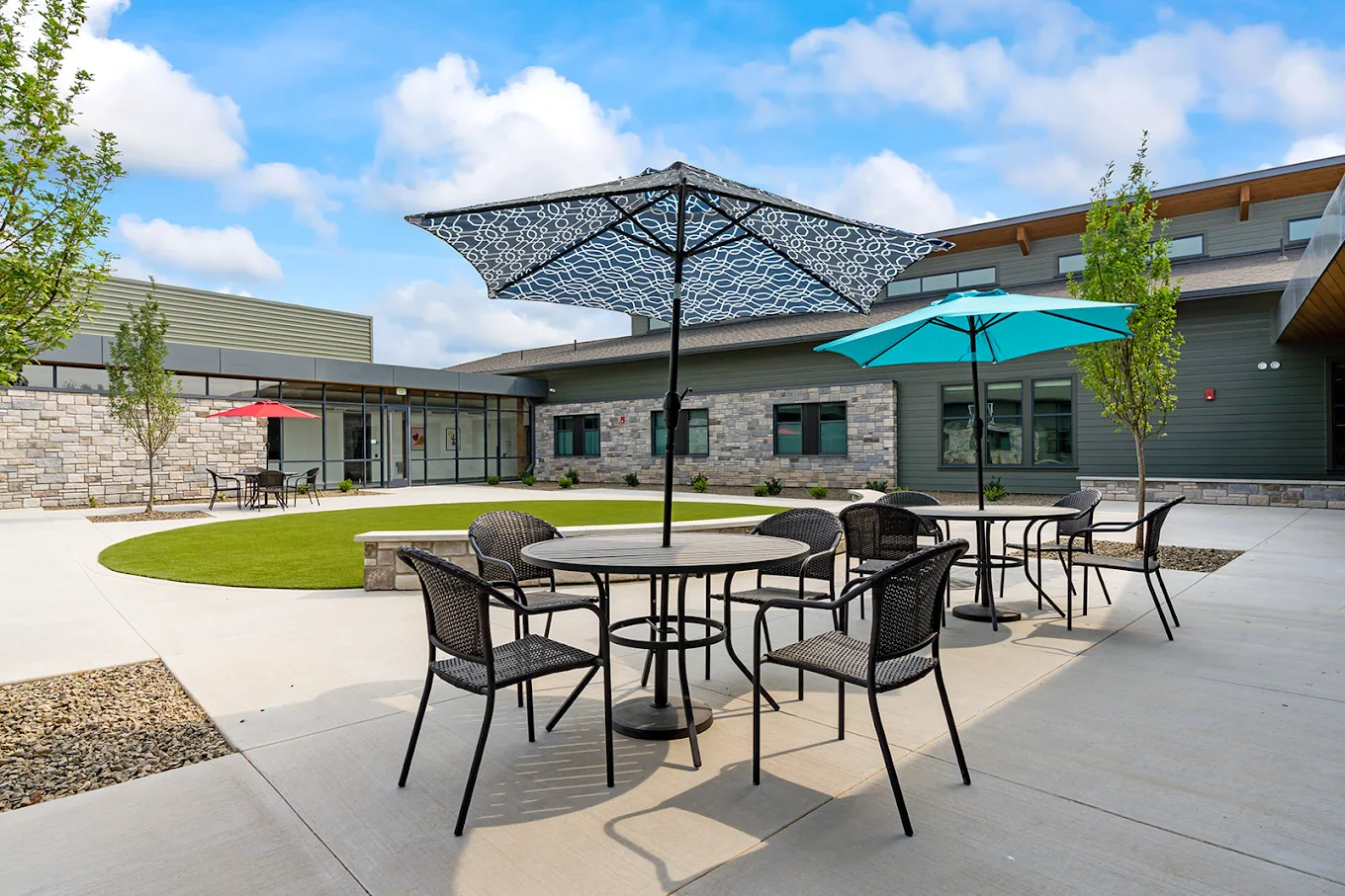 Outdoor courtyard with patio seating and umbrellas