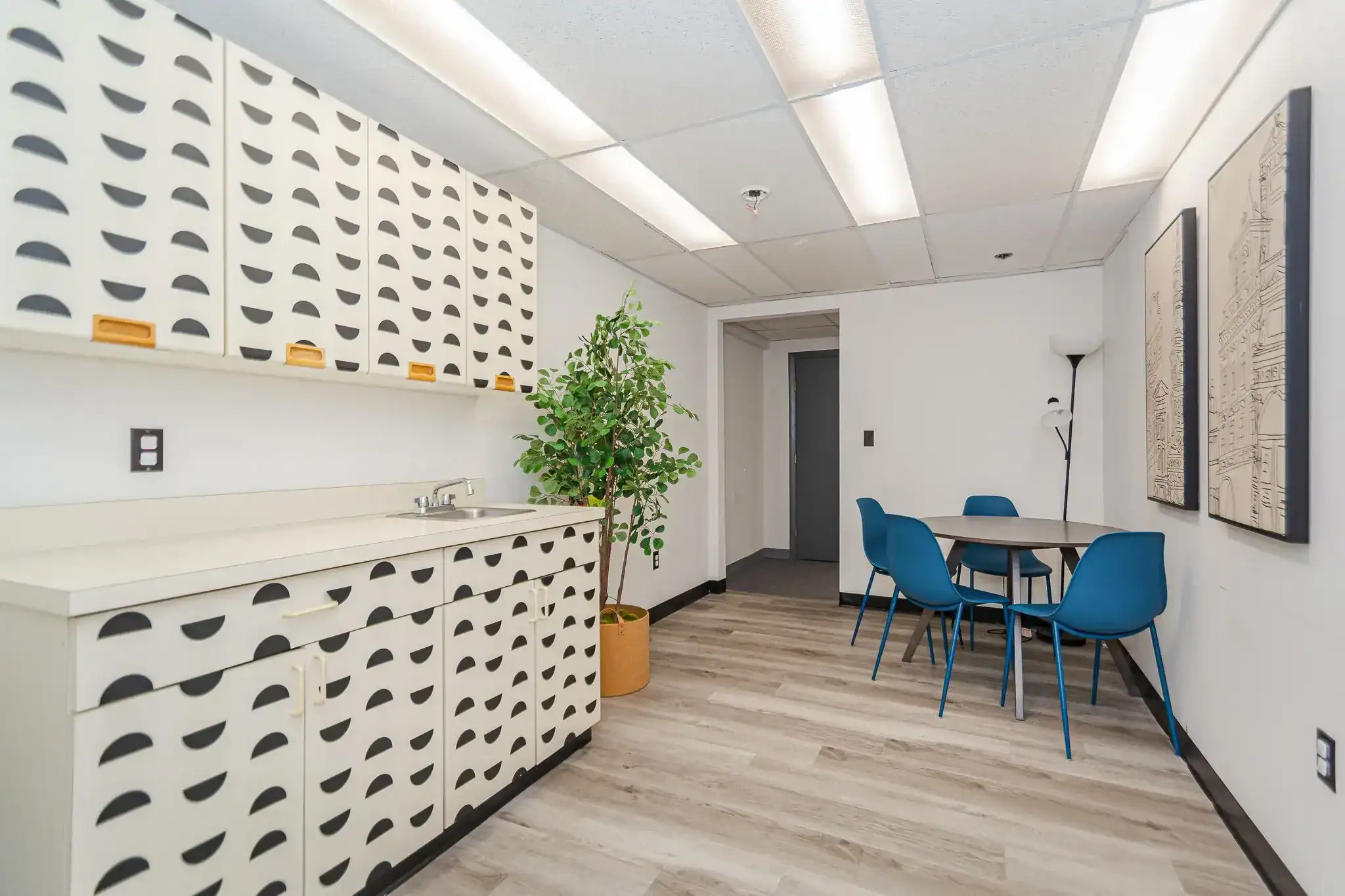 Break room with table seating and kitchenette