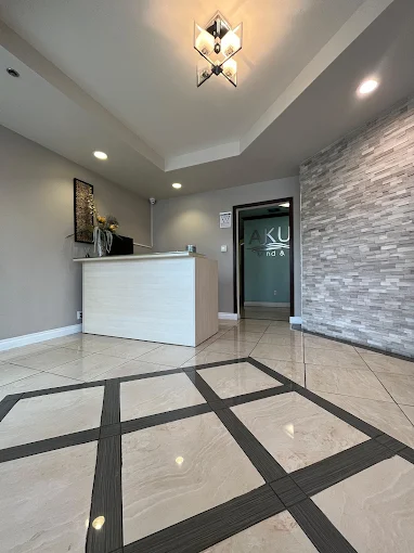 Front desk and stone accent wall in reception area