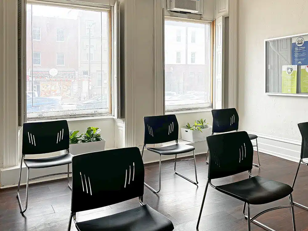 Waiting area with chairs and large street-facing windows