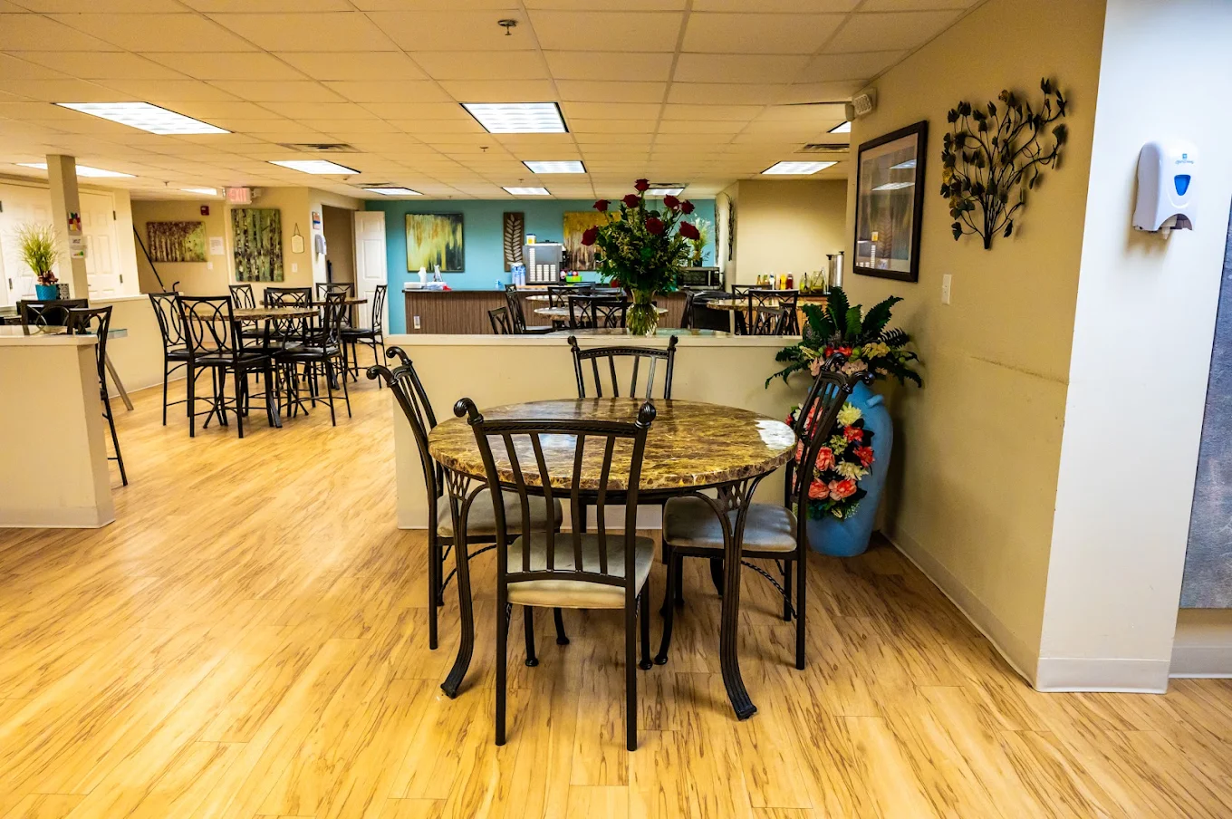 Dining area with tables, chairs, and serving counter