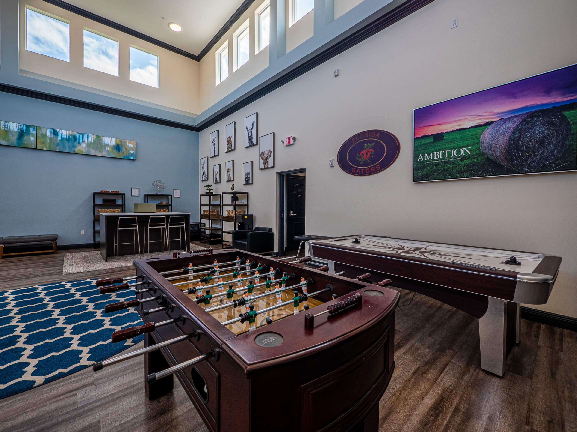 Game room with foosball table and shuffleboard.