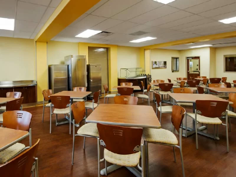 Spacious dining area with wood tables and chairs