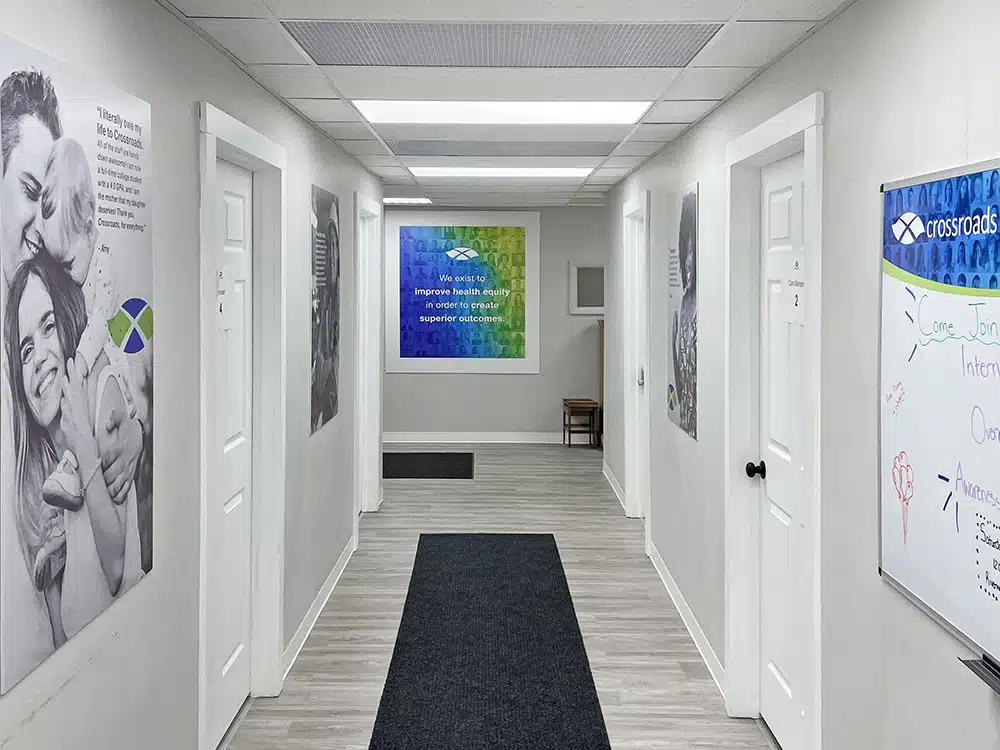 Hallway with office doors and recovery posters on walls