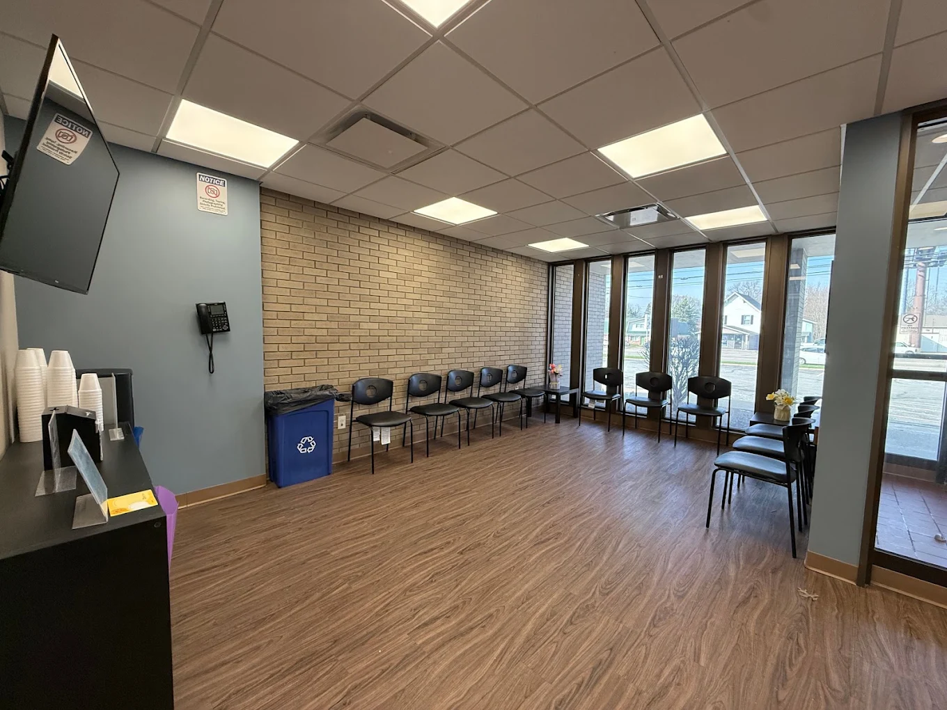 Bright lobby with rows of chairs and large windows