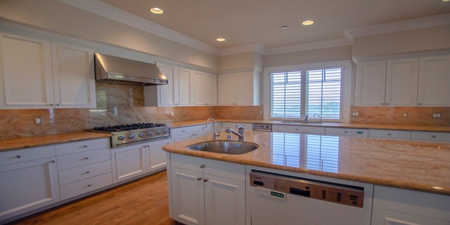 Kitchen with granite countertops and stainless steel appliances.