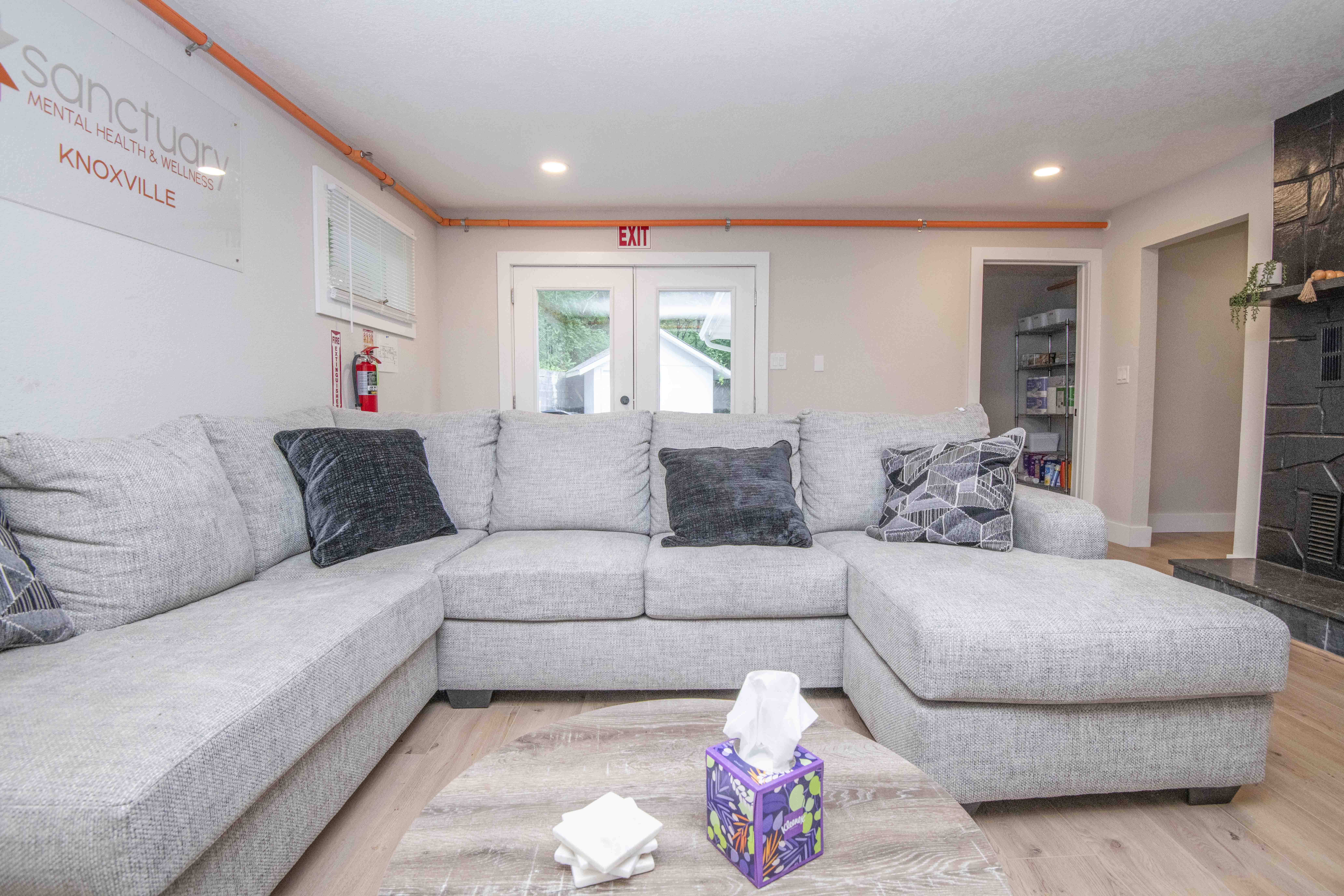 Gray sectional sofa in cozy group meeting room