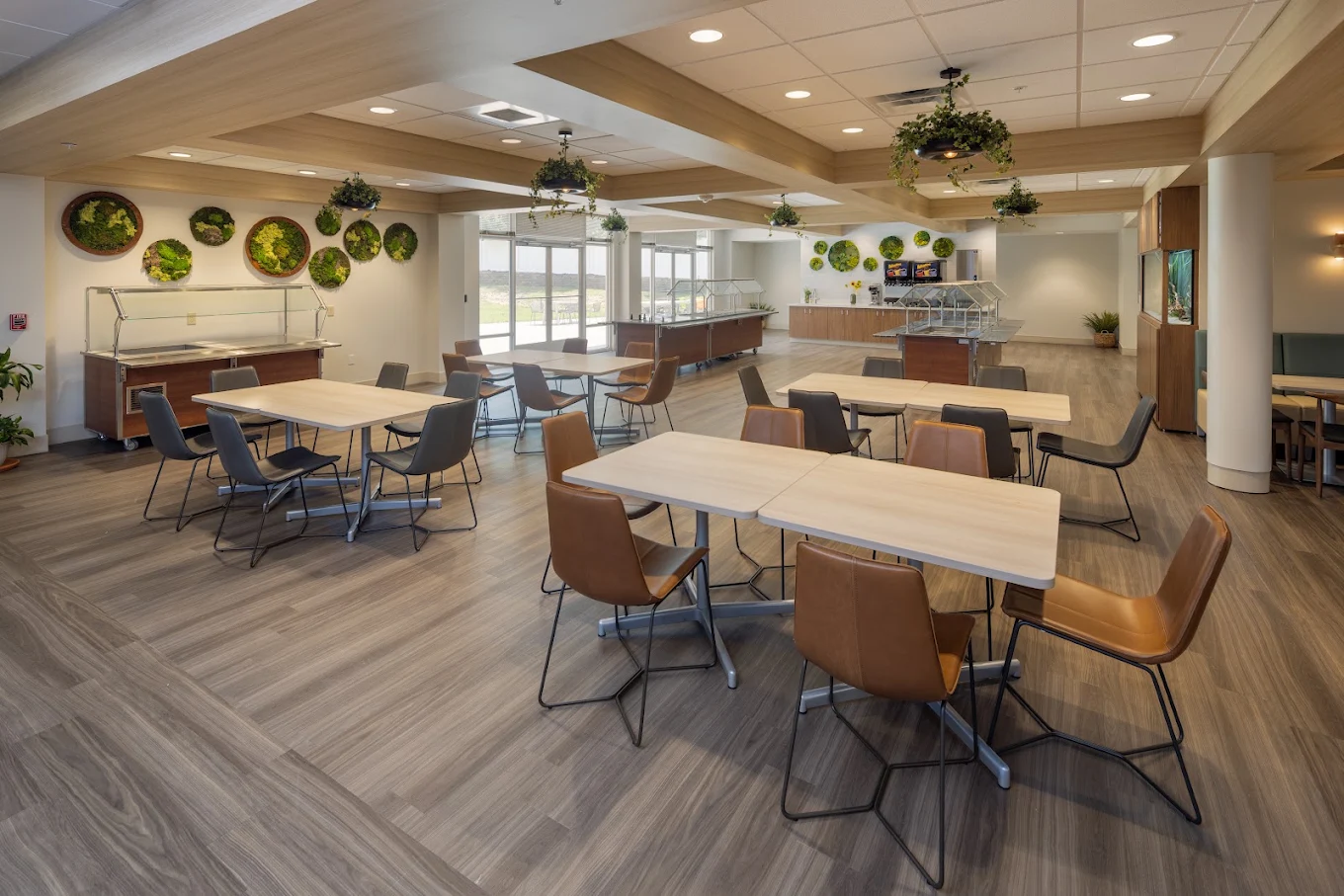Spacious dining room with tables, chairs, and serving stations