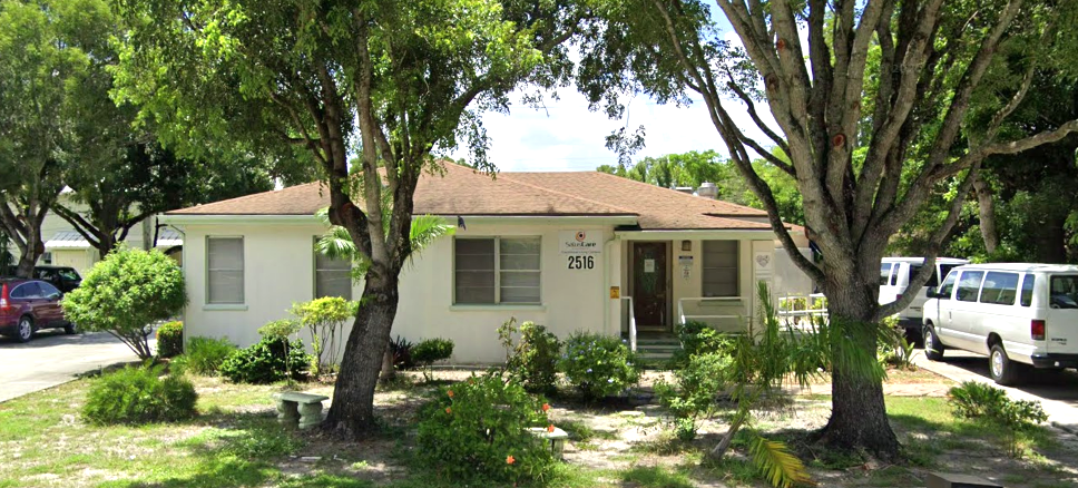 Single-story residential building with front entrance and garden
