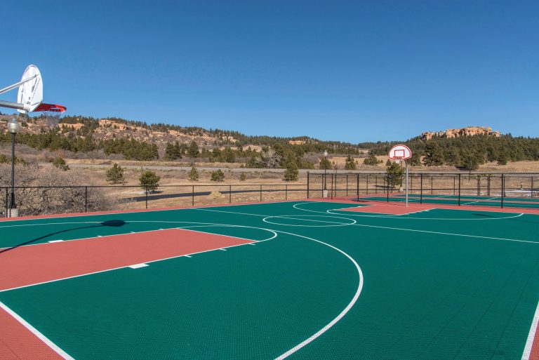 Outdoor basketball court with scenic mountain views