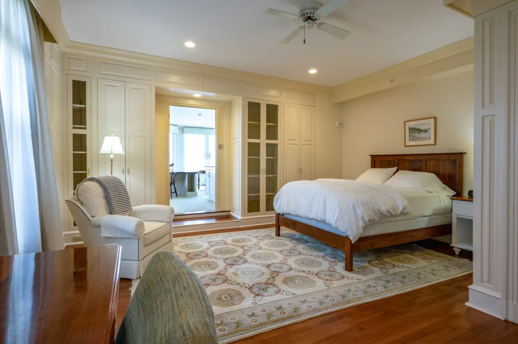 Spacious private bedroom with bed and sitting area