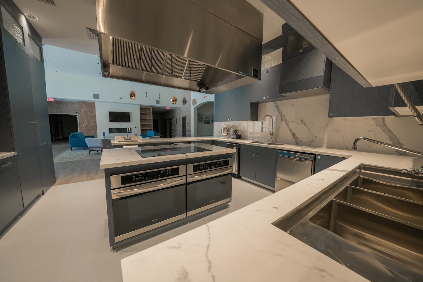 Stylish kitchen with blue cabinetry and high-end finishes.