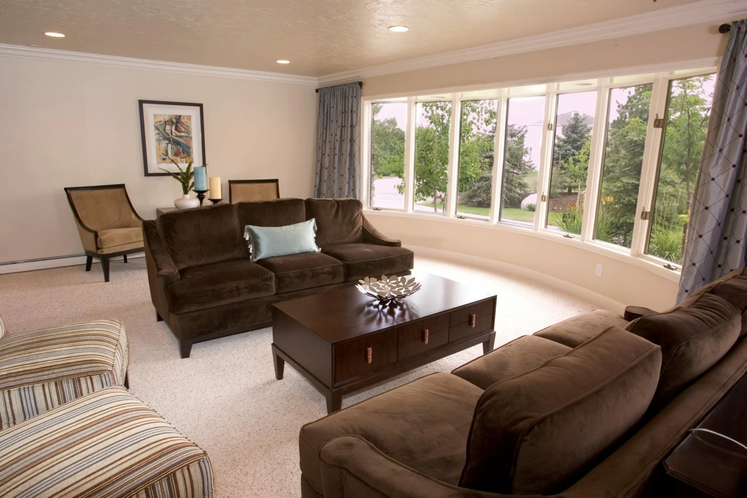 Spacious lounge with large windows and comfortable seating