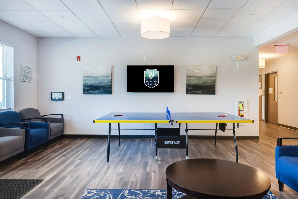 Recreation room with ping pong table and lounge seating