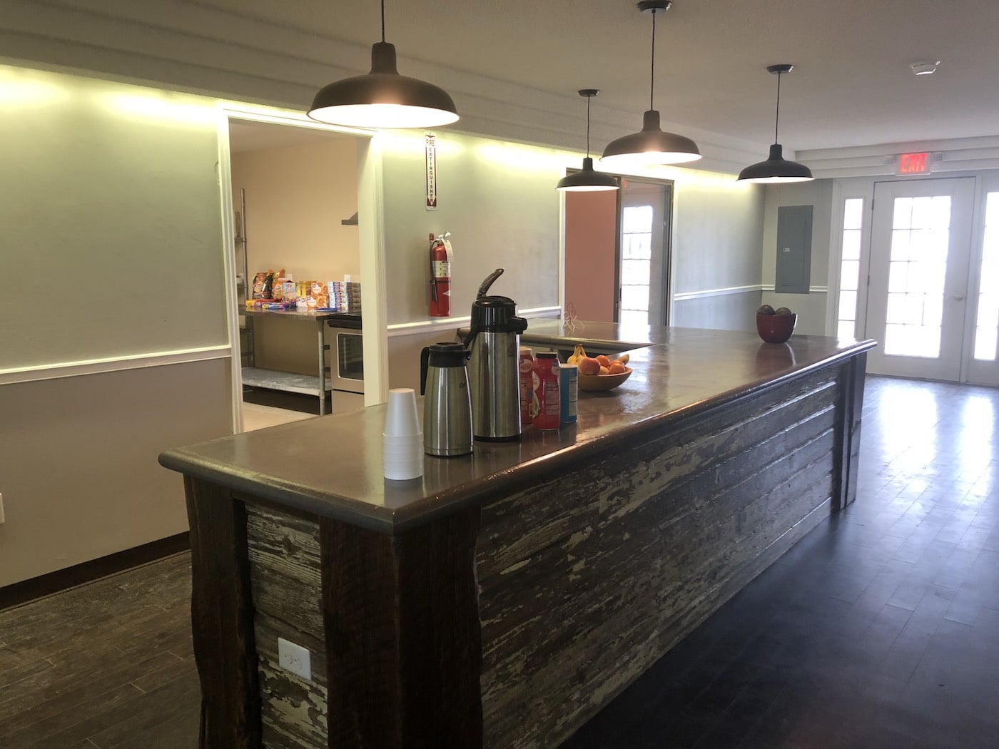 Coffee station with counter and snacks nearby