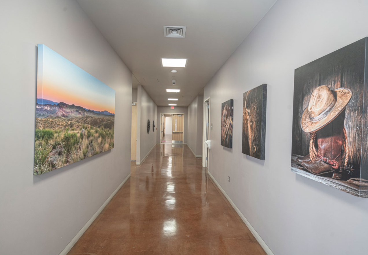 Interior hallway with artwork and polished floors