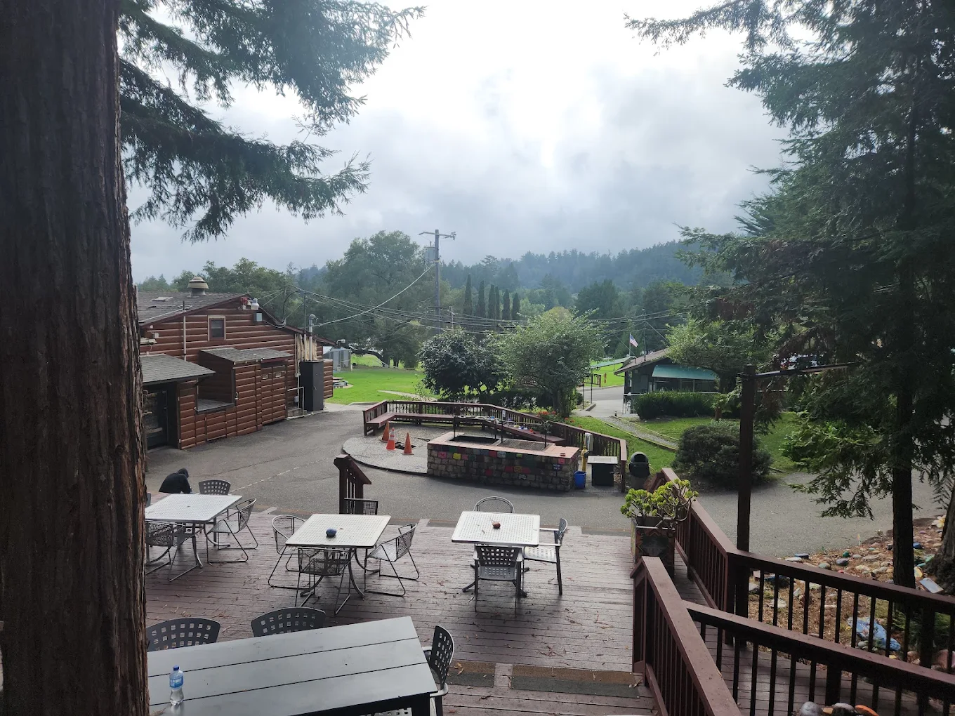 Outdoor deck seating overlooking wooded campus