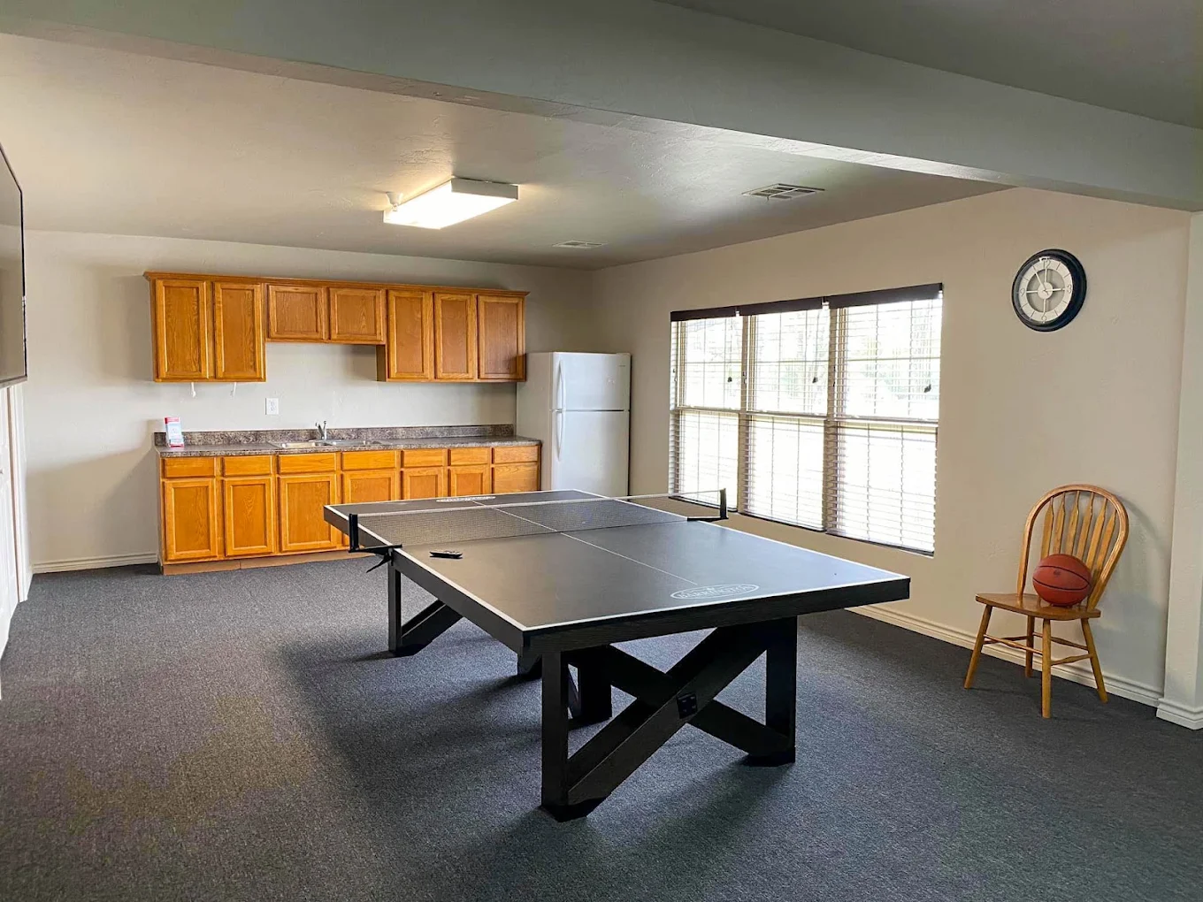 Game room with ping pong table and kitchenette