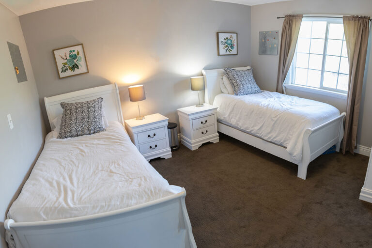 Shared bedroom with twin beds at Ascend Recovery