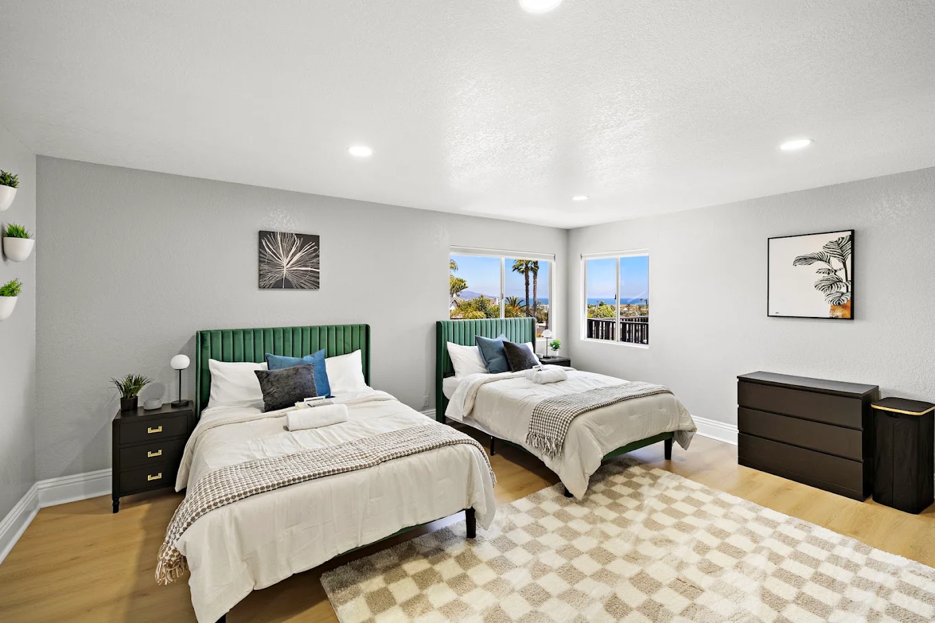 Shared bedroom with two beds and ocean views from windows