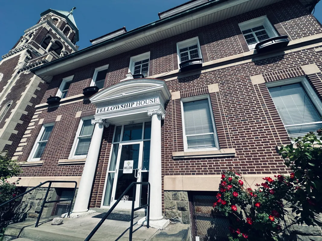 Brick rehab center with white-columned entry