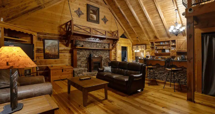 Cozy living area with wood interiors and stone fireplace