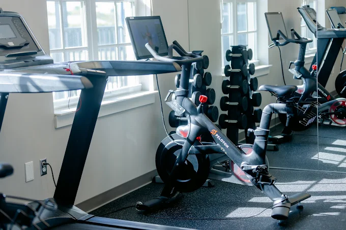 Cardio machines and weights in rehab fitness room