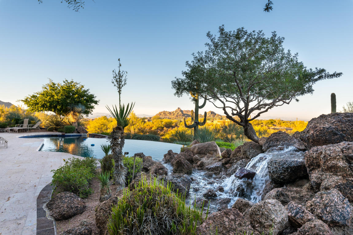 Infinity pool with desert landscape.