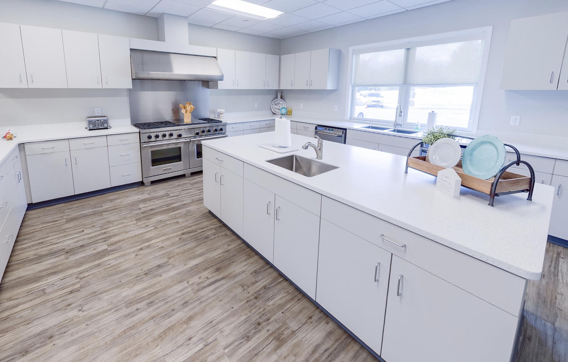 Bright kitchen with white cabinets and central island