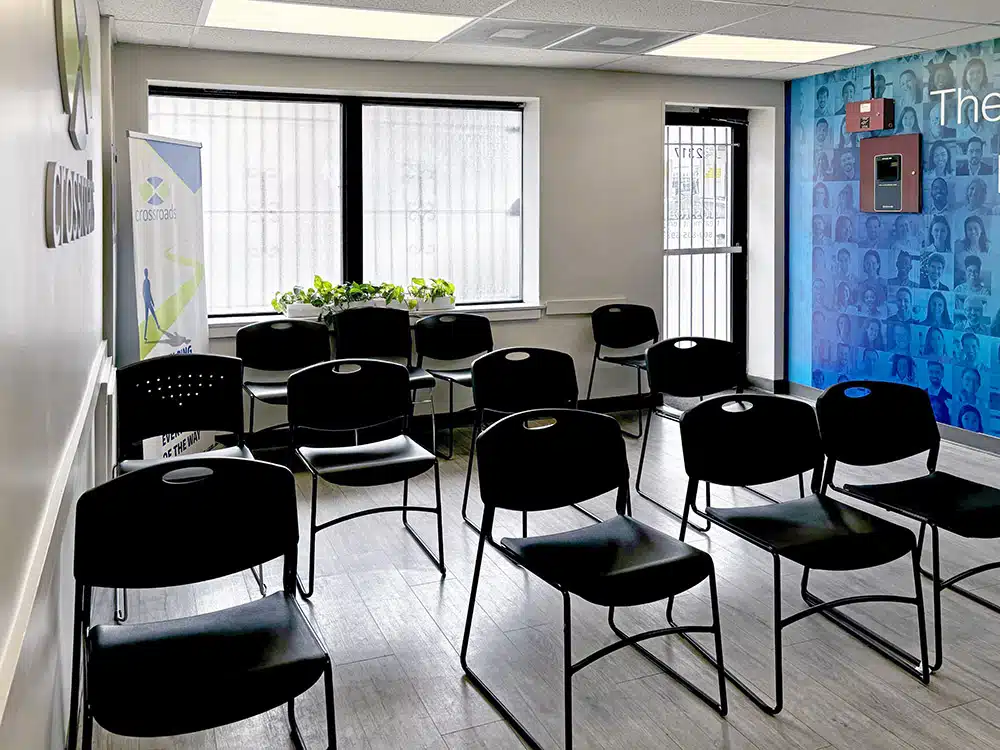 Rows of black chairs arranged in clinic waiting area