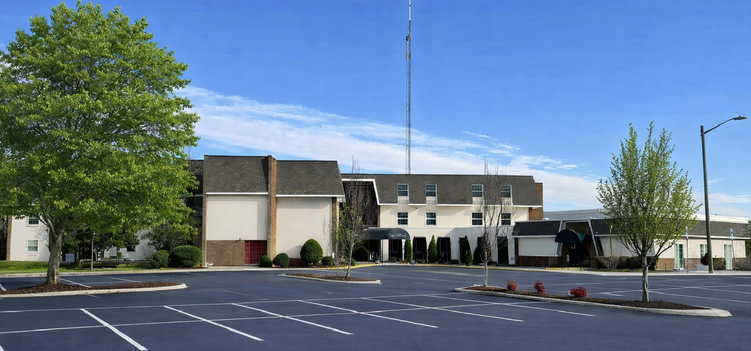 Wide campus view of treatment center building