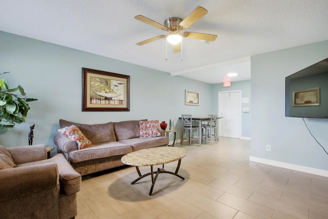 Cozy living room with sofas, table, and wall art