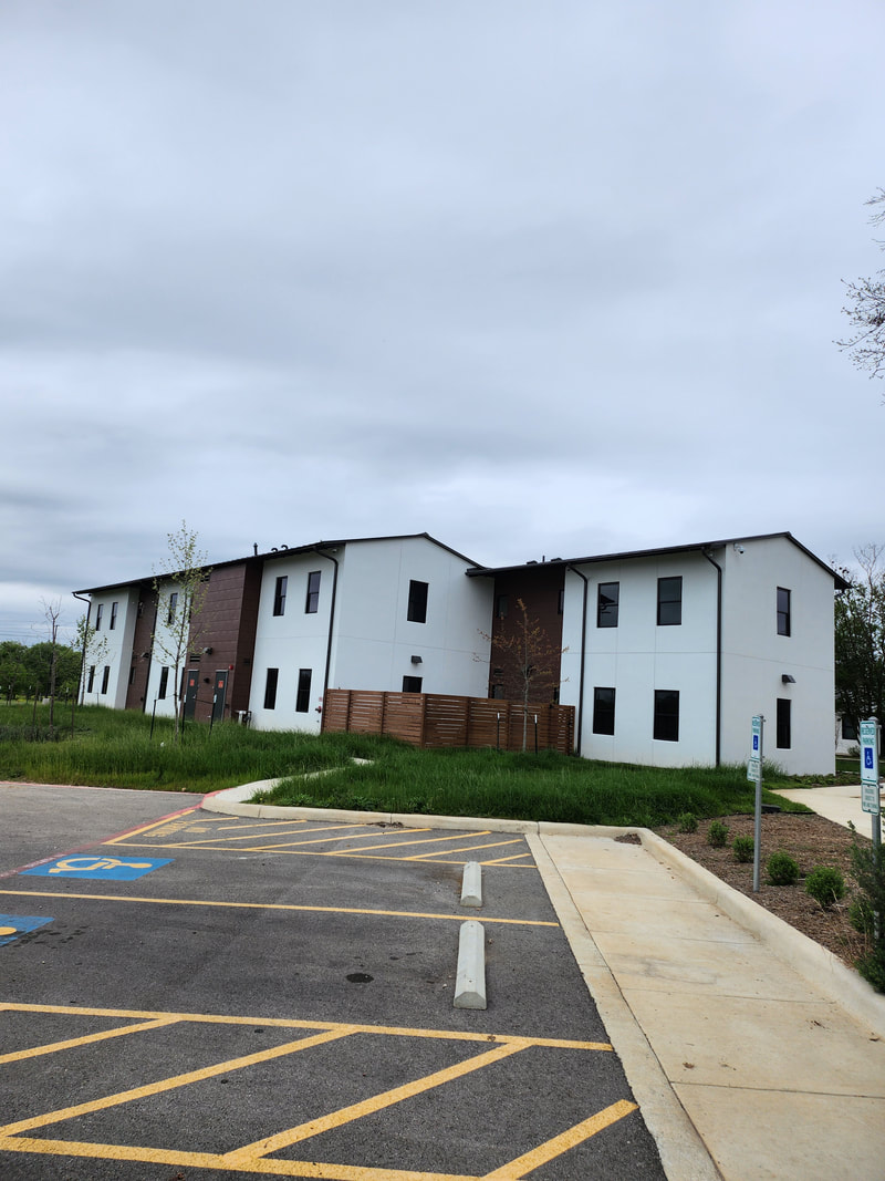 Modern residential hall with white and brown exterior