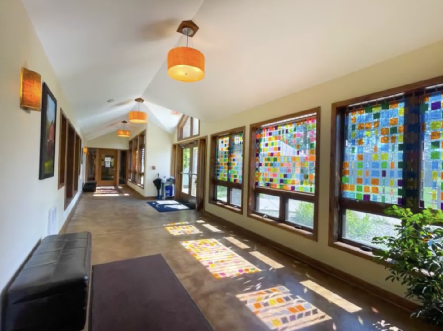 Bright hallway with stained-glass-style window panels