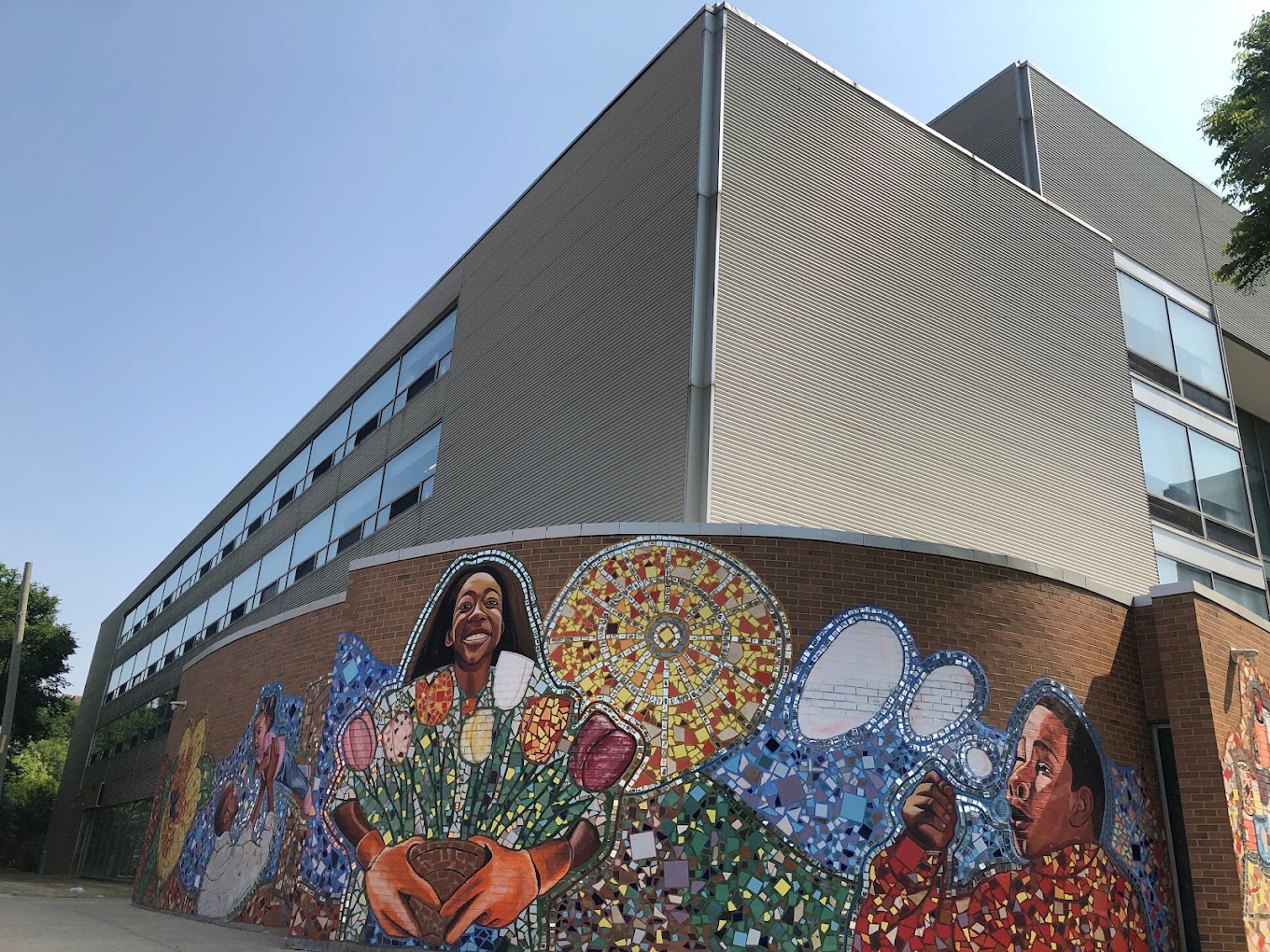  Colorful mosaic mural on brick wall of A Safe Haven building