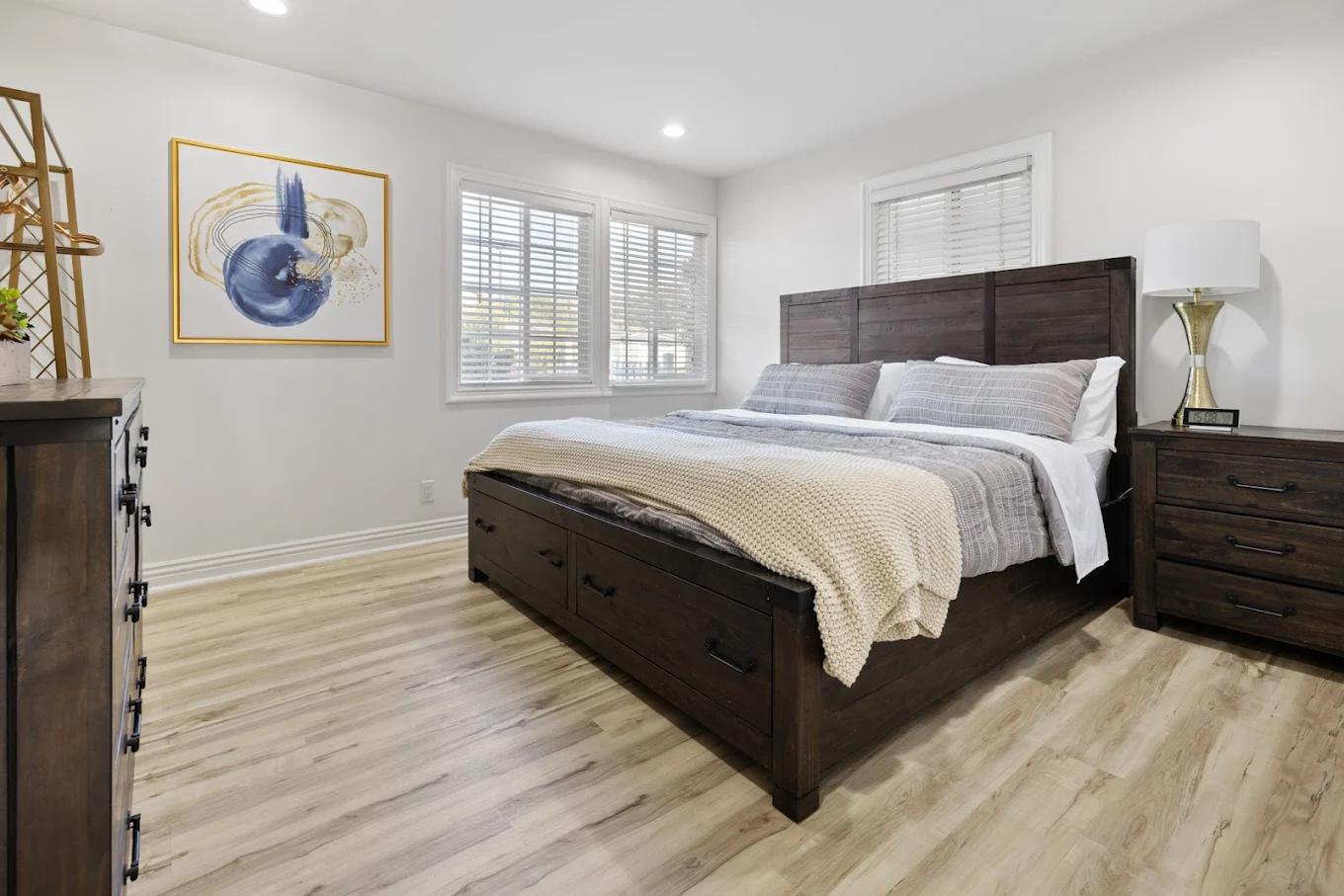 Private bedroom with wood bed frame and natural light