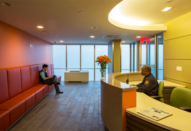 Reception desk with seating in a bright waiting area