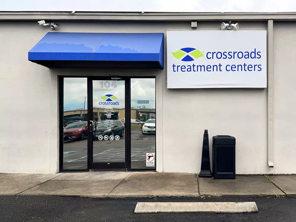 Exterior entrance with glass doors and Crossroads sign