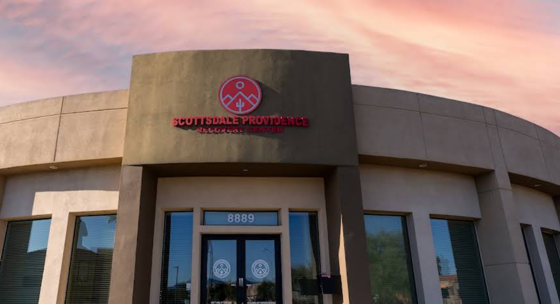 Front entrance of Scottsdale Providence with signage and logo